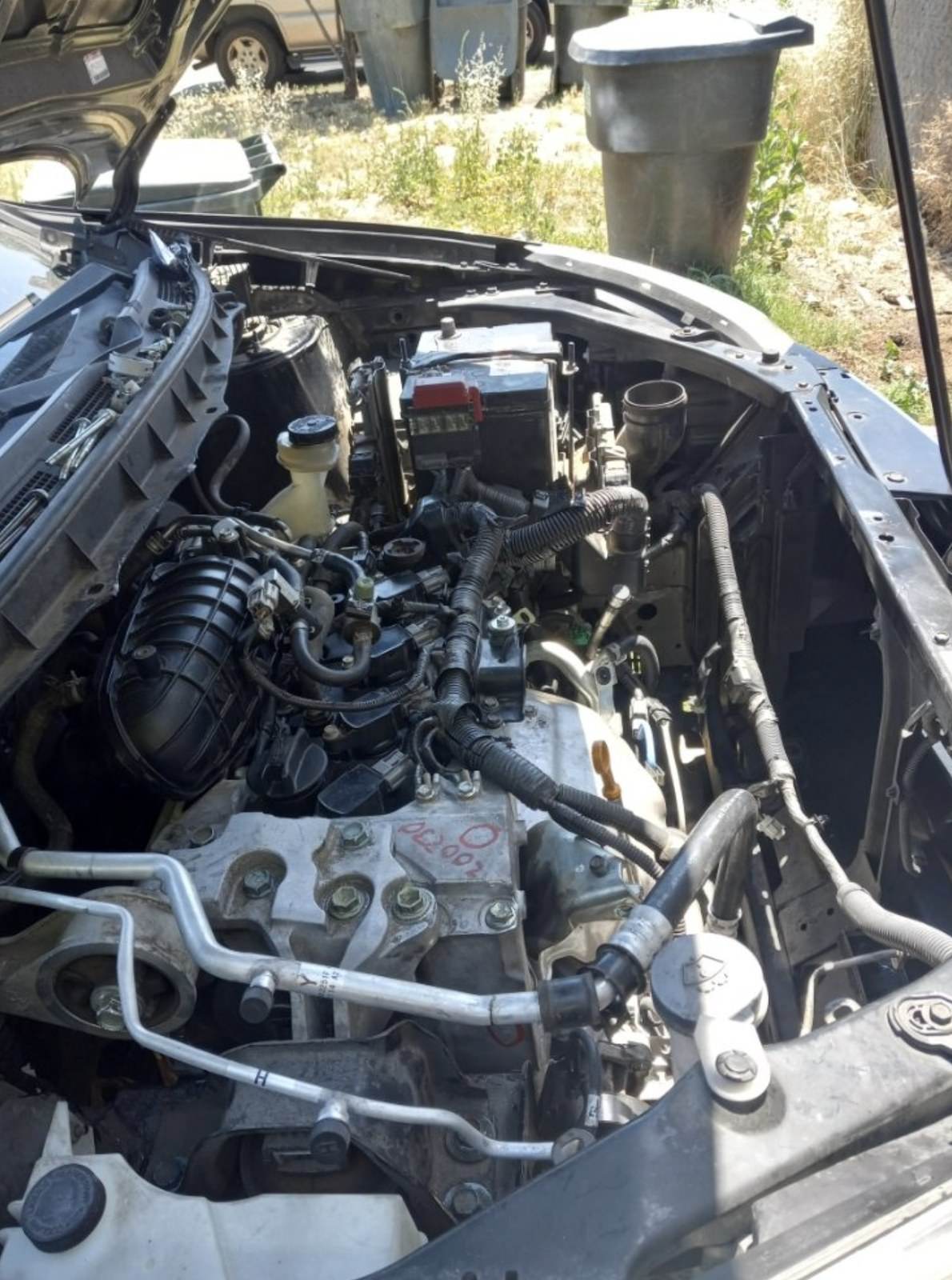 Ventura mobile mechanic checking an engine during diagnostics